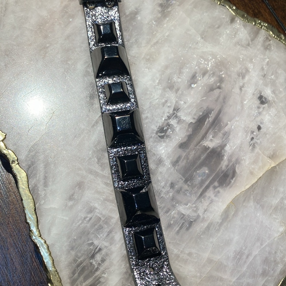 Designer leather spike cuff bracelet in gunmetal metallic